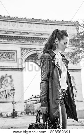 Pensive Modern Woman Near Arc De Triomphe In Paris, France