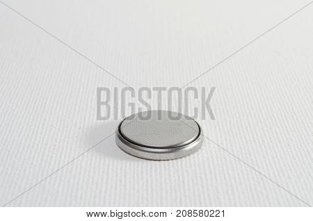 A Close-up Studio Photograph of a Button Cell Battery CR2032
