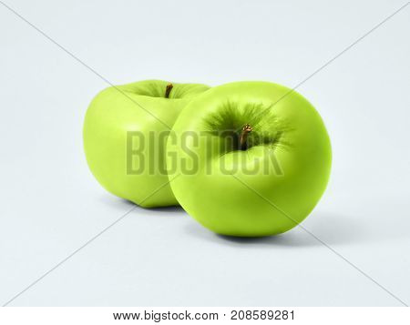Isolated green apples Fresh granny smith Two juicy green apples are lying on a white background Isolated fruit's photo