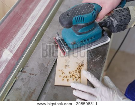 A carved plate on which the patterns and inscriptions are burned out which the master processes with a special tool