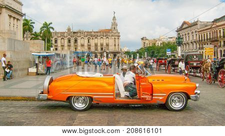 February 2012 Havana - During this time of year these beautifully restored vintage cars bring tourists to visit the streets of the Havana center driven exclusively by their jealous owners