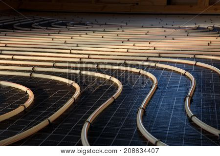 Construction of house. Tubing are elements of radiant floor heating system
