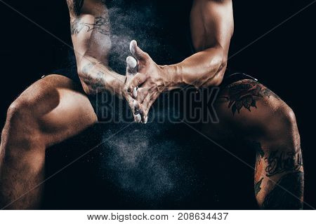 Sportsman Applying Talcum To Hands