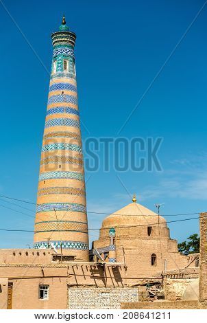 Islam Khodja Minaret at Itchan Kala. A UNESCO heritage site in Khiva, Uzbekistan