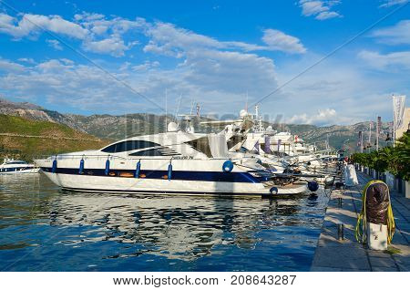BUDVA MONTENEGRO - SEPTEMBER 5 2017: Pleasure yachts at pier in Dukley marina near promenade of Budva Montenegro