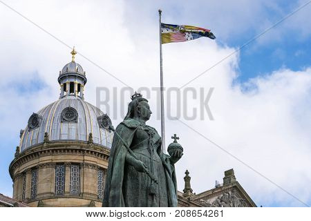 Birmingham, UK, October 3rd, 2017 : Statue of Queen Victoria in Birmingham, UK, Birmingham city council in the background.