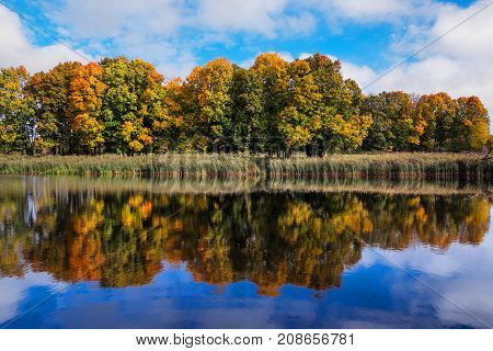 Reflection Of Autumn Forest In The Lake.