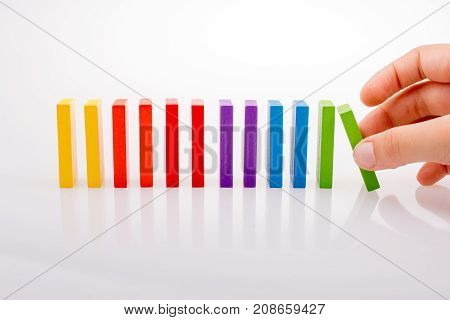 Hand Holding Color Dominoes