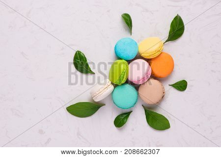Macaroons dessert. Traditional french colorful macarons on table.