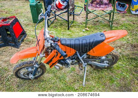 Extreme sports children's motorcycle children's motocross. Motorcycle of orange color