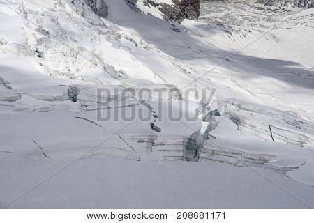 Glacier crevasses and seracs in a snow field in the Mont Blanc area.