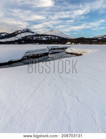Snow on South Sister reflected in Soda Creek in the Deschutes National Forest Oregon.
