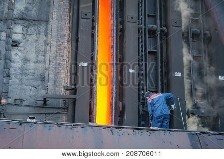 Coke Furnace. Production Of Coke. Steel Works. The Person Loads Coke In The Furnace. The Heated Coal