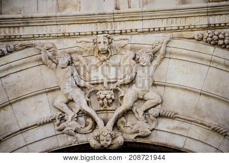 Historic details of stone sculptures of the facade of the University of AlcalÃÂ¡ de Henares. Madrid, Spain