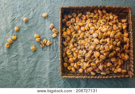 Roasted Corn nuts in a woven Basket