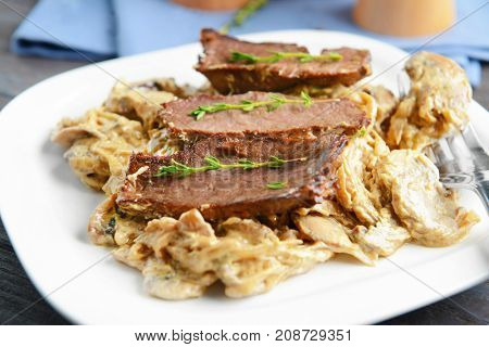 Plate with steak Diane, closeup