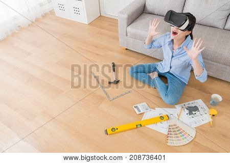 Woman Wearing Vr Technology Sitting On Floor