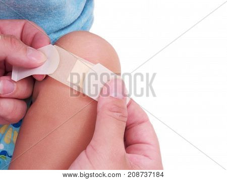 a little child with a wound isolated on white.