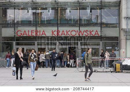Galeria Krakowska shopping centre main square with entry Cracow Poland - October 13 2017: People come in and out to Galeria Krakowska shopping centre Cracow Poland.