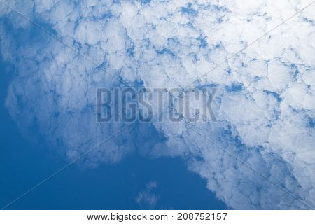 Altocumulus cloudscape on blue sky Beautiful Cirrocumulus white clouds in the sunny day.