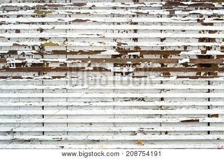 Old small wooden boards with peeling paint