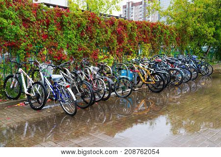 Zelenograd, Russia - September 15. 2017. bicycle parking at Kryukovo station in the fall in a puddle