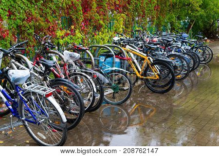 Zelenograd, Russia - September 15. 2017. bicycle parking at Kryukovo station in the fall in a puddle