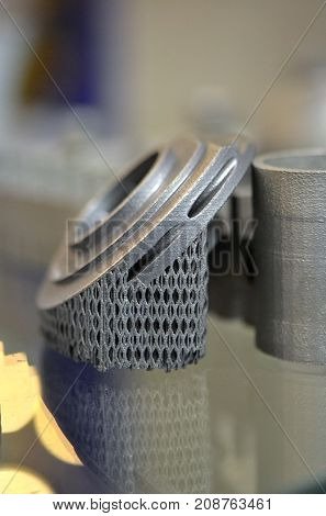 Object printed on metal 3d printer. A model created in a laser sintering machine close-up. DMLS SLM SLS technology. Concept of 4.0 industrial revolution. Progressive modern additive technology.