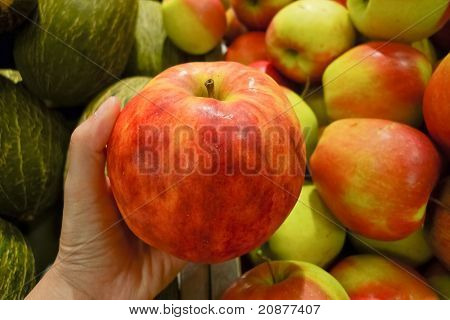 Holding An Apple At Fruit Stall