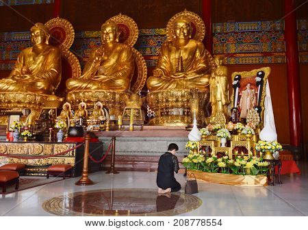 Bangkok Thailand October 14, 2017 : Thai woman pay respect to image of the late king Bhumibol Adulyadej in Leng Nei Yi 2 or Barom Racha Kajanapisek Anusorn Canasongjennigairangsan Chinese temple