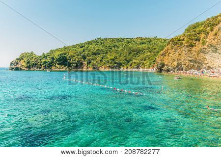 Budva, Montenegro - August 18, 2017: Fragment of Mogren beach in Budva, Montenegro is one of the most popular beaches on the Budva Riviera.