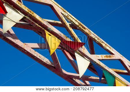 Colored metal construction on blue sky background