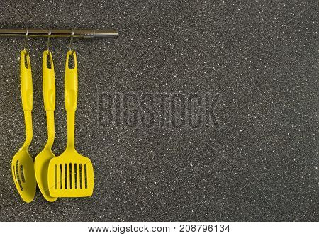 kitchen appliances yellow with scoop spatula spoon