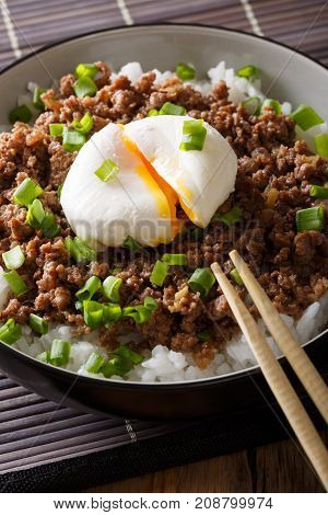 Japanese Spicy Beef Soboro With Egg Benedict, Rice And Green Onion Close-up. Vertical