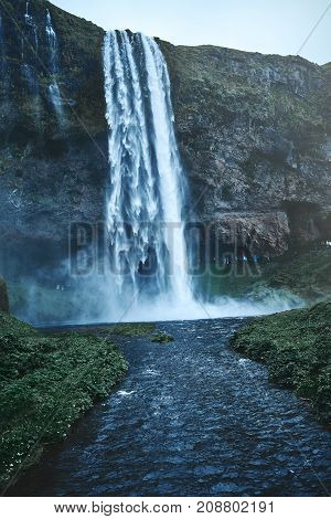 famous Seljalandsfoss waterfall in southern Iceland. treking in Iceland. Travel and landscape photography concept