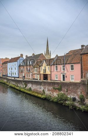 NORWICH, NORFOLK, 4TH OCTOBER 2017 - Colourful houses on the quayside of river Wensum as it flows through the city of Norwich Norfolk UK