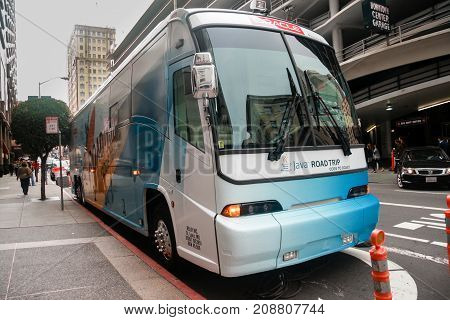 SAN FRANCISCO CA US - SEPT 19 2010: Bus for attendees of Oracle OpenWorld JavaOne conference transportation at downtown street in San Francisco on Sept 19 2010.