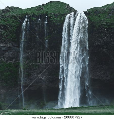 famous Seljalandsfoss waterfall in southern Iceland. treking in Iceland. Travel and landscape photography concept