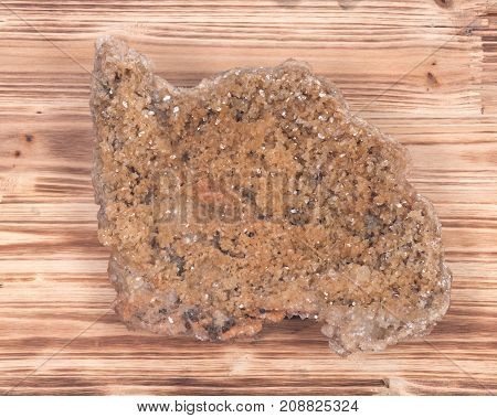 Creedite Crystal Cluster from Mexico, on vintage wooden background
