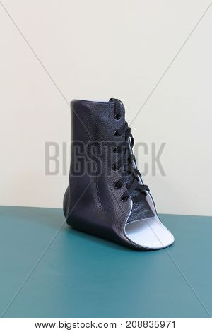 Black leather lace up ankle brace quarter turn