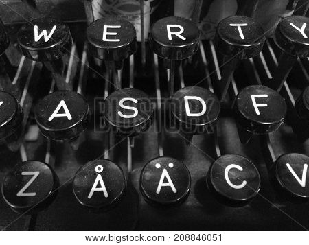 Finnish vintage typewriter including uppercase letter A with ring, letter A with diaeresis, QWERTY, and ASDF keys.
