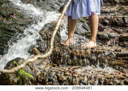 Bare Female Feet On The Water