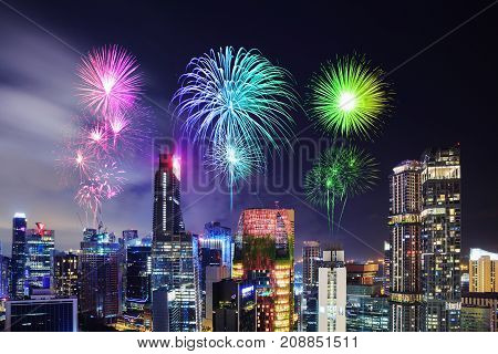 Firework Over Cityscape Of Singapore City At Night