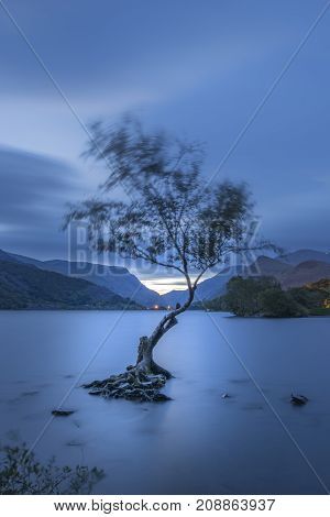 Beautiful Landscape Image Of Llyn Padarn At Sunrise In Autumn In Snowfonia National Park