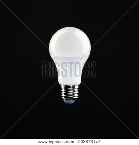 Light bulb shiny rendered on black bakground