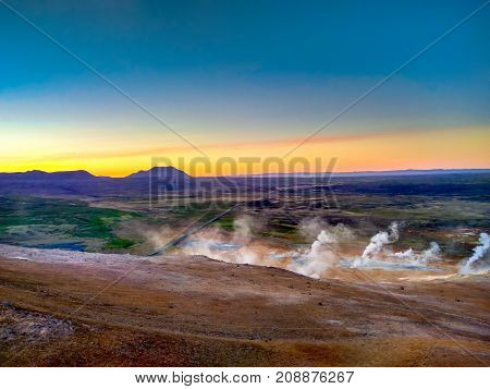 a lot of geysers in Iceland at sunset
