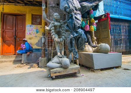KUMARTULI KOLKATA INDIA - OCTOBER 10 2014 : Clay idol of Goddess Kali at Kumartuli Kolkata India. Idols are being prepared to be worshipped during Kali Puja Hindu festival of Deepavali or Diwali.