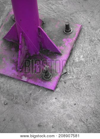 COLOR PHOTO OF SCREWS AND NUTS ON LAMP POST CONCRETE BASE