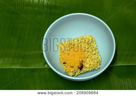 Before boiling noodle spicy on banana leaf