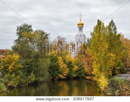 Saint Petersburg autumn. The Smolenka river and the dome of the Church of the Resurrection